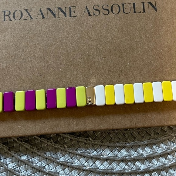 Roxanne Assoulin Enamel coated stretch bracelet with a gold tone logo - Picture 2 of 2